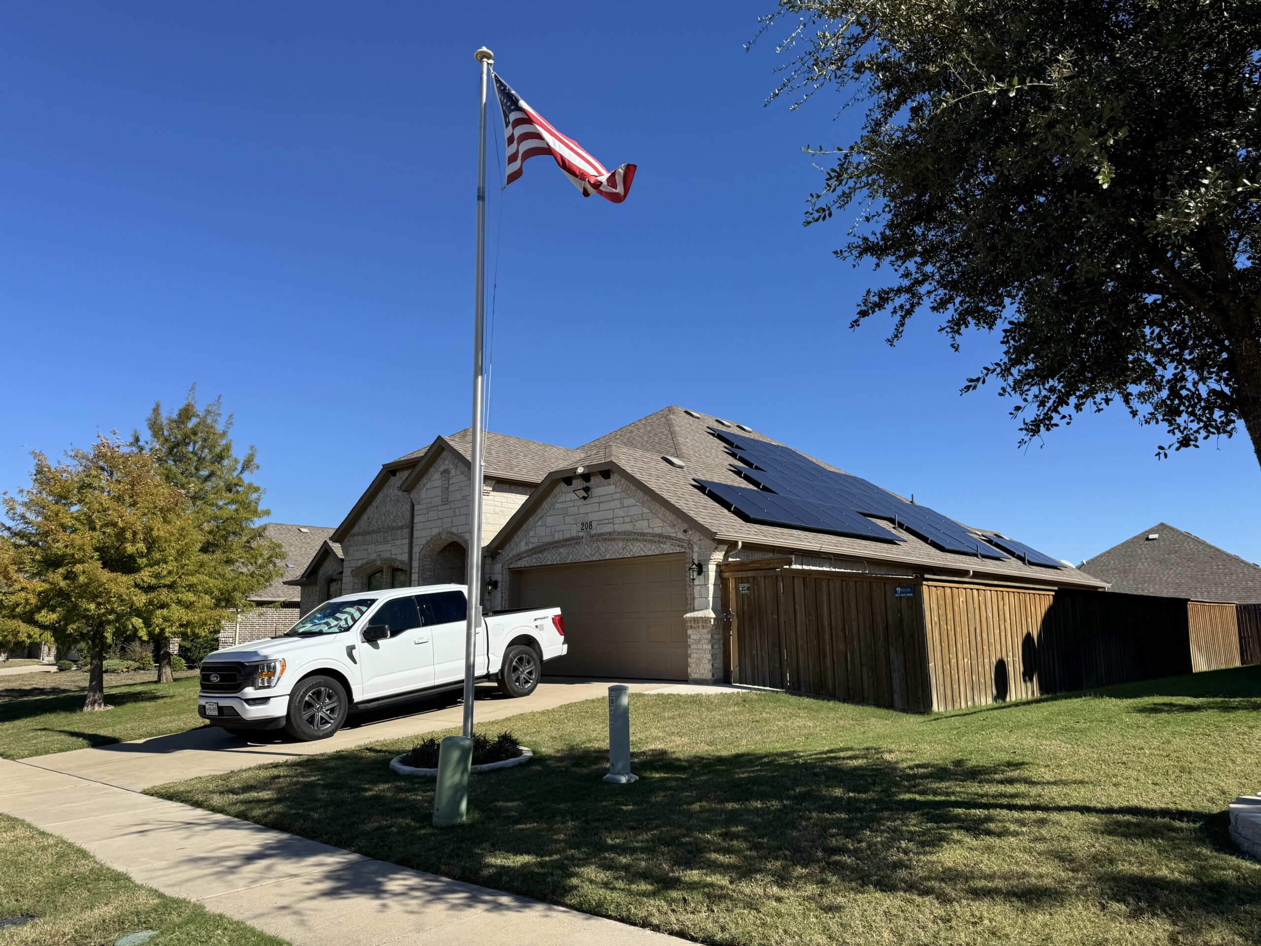 Divine Energy Solar crew removing solar panels from a roof